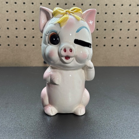 The Unbranded Brand Other - Vintage Japanese Ceramic Piggy Bank with Winking Expression And a Yellow Bow